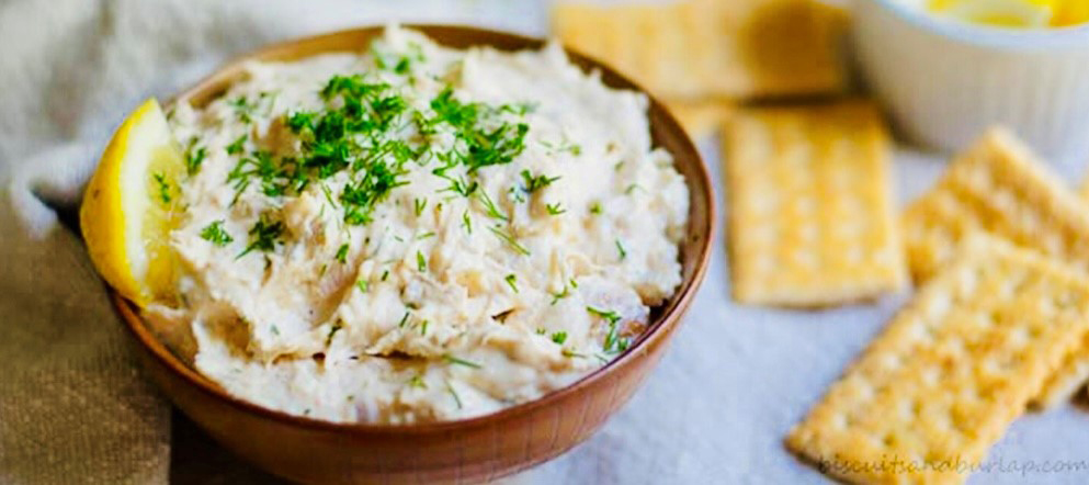 bowl of dip with crackers nearby